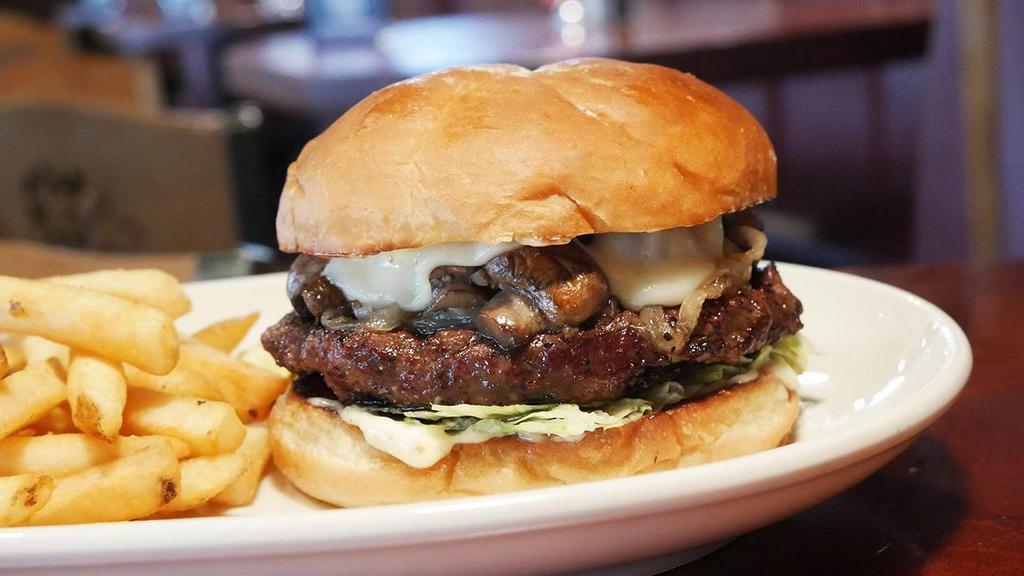 Wagyu Burger · 1/2 lb. grilled American Wagyu beef patty, topped with garlic roasted mushrooms, Wisconsin creamy havarti cheese, caramelized onions, iceberg lettuce, garlic mayo, grilled kaiser bun.