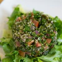 Tabbouleh Salad · Vegetarian. 
Tabbouleh salad- chopped parsley, tomato, onion, bulgur wheat, mint, olive oil,...