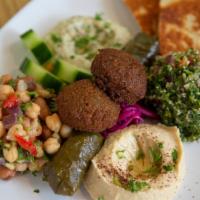 Veggie Combo Plate · Vegan. Our unique combination plate of falafels, hummus, baba ghanoush, tabbouleh salad, bea...