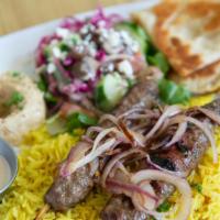Kofta Kebab Plate · Skewered minced lamb and beef mixed with herbs and spices char-broiled and served over rice,...