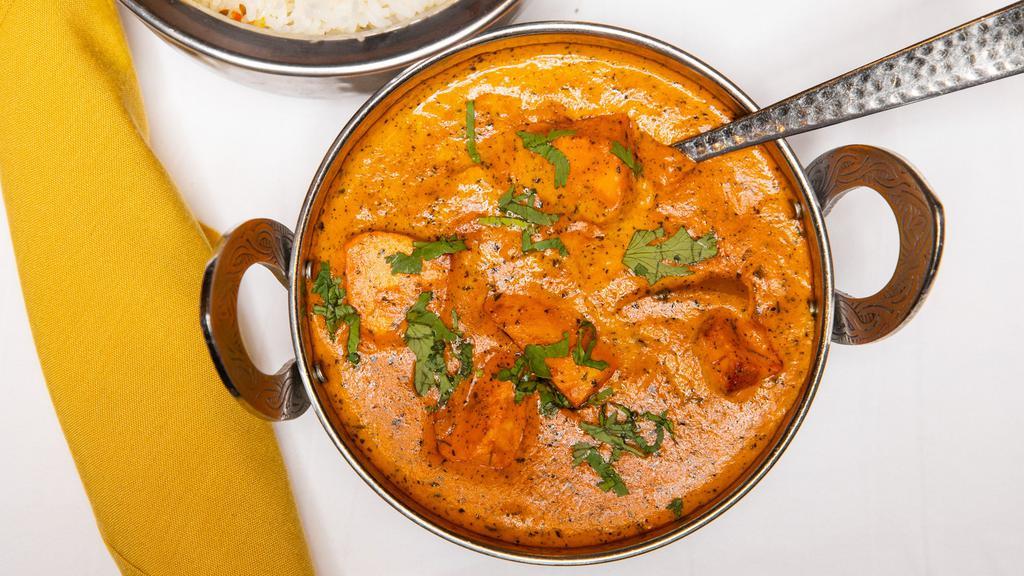 Chicken Tikka Masala (D) · tandoori chicken breast cooked in a masala base of onions, bell pepper, tomatoes & cream