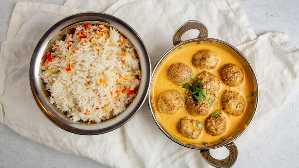 Malai Kofta · Fresh grated vegetables cooked in grain flour buttery and deep fried. Served in fresh cream of tomato and onion sauce. Served with basmati rice.