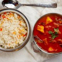 Lamb Vindaloo · Lamb cooked in hot spices in a highly seasoned gravy of potatoes, tomatoes, and chili pepper...