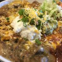 Phoenix Fiesta Bowl · Our favorite Sonoran Entrees layered into a bowl with melted cheese, Guacamole, Sour Cream, ...