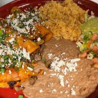 Tacos Al Carbon · Three corn tortillas filled with sliced grilled tender skirt steak or chicken and topped wit...