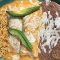 Spicy Enchilada · Spicy. Two enchiladas filled with choice of meat and topped with our spicy cream sauce, and ...