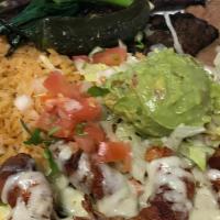 Carne Asada With Camarones Con Tocino Special · Carne Asada and shrimp wrapped in bacon served with rice, beans, cheese, guacamole, and a to...