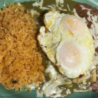 Sunnyside Enchilada · 2 Enchiladas stuffed with meat, topped with salsa verde, two eggs over medium. Served with r...