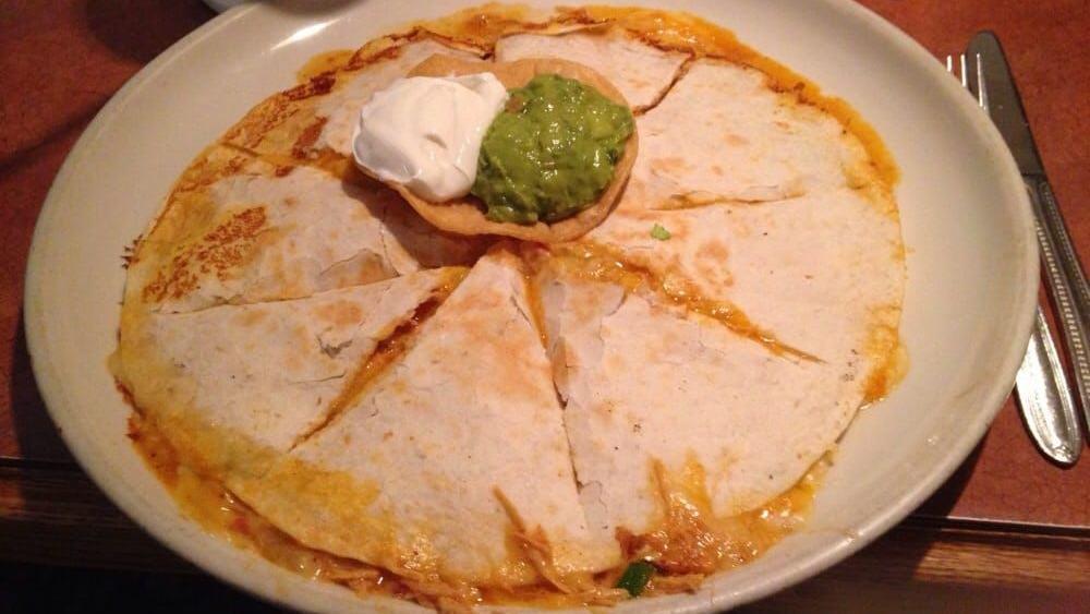 Meat Quesadilla · Large flour tortilla with choice of meat, melted cheese, served with sour cream, guacamole, fresh tomatoes, and green onions.