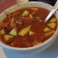 Tortilla Soup · Savory broth with chicken, tortilla strips, avocado, onions, tomato, cilantro, and cheese.