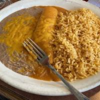 Kids Enchilada · Your choice of chicken, or ground beef. Served with rice and beans.