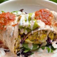 Breakfast Burrito · Rice pilaf, tofu scramble, and slaw rolled into a coconut or sprouted wheat tortilla topped ...