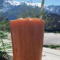 Orange Smoothie · Mango, pineapple, peaches, strawberry with a carrot ginger turmeric juice and banana.