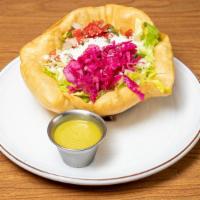Tostada Salad · Tostada bowl, lettuce, cabbage, black beans, pico, and cotija. Choice of ranch, lime vinaigr...