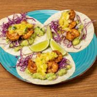 Shrimp Tacos · 3 tacos, marinated shrimp, guacamole, shredded cabbage, and jalapeno-pineapple salsa.