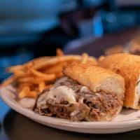 Steak It To The Limit Philly Cheese Steak Sandwich · Grilled steak (or substitute with grilled chicken), sautéed onions, and melted American chee...