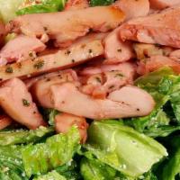 Prickly Pear Caesar Chicken Salad · Tossed in our house-made caesar dressing, topped with grilled prickly pear glazed chicken br...