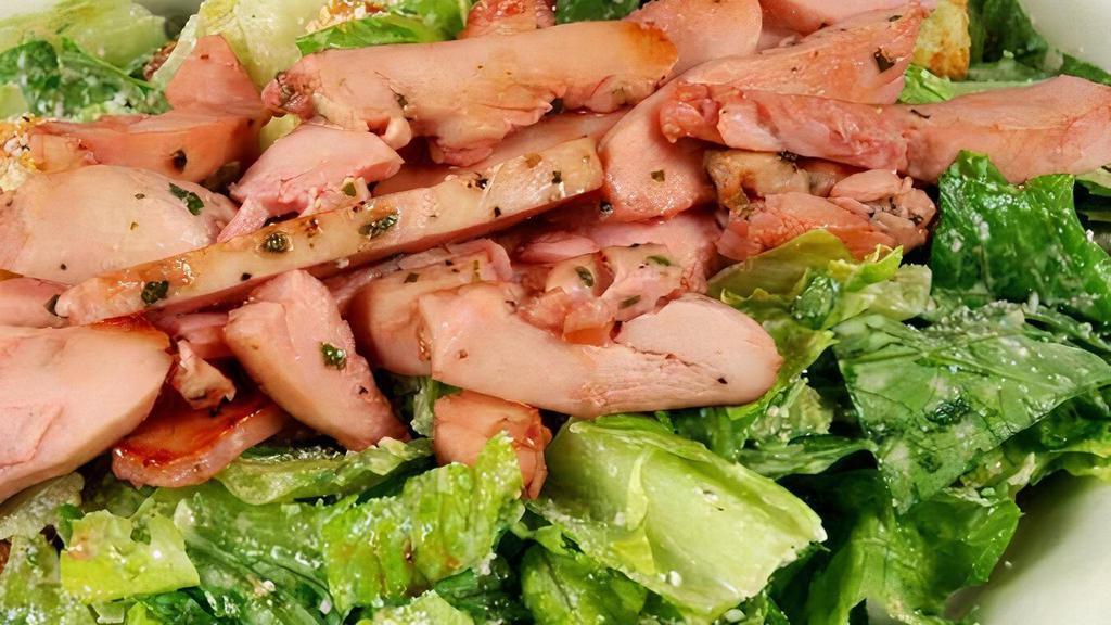 Prickly Pear Caesar Chicken Salad · Tossed in our house-made caesar dressing, topped with grilled prickly pear glazed chicken breast.