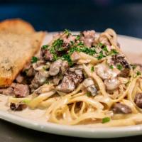 Said The Joker To The Beef · Stroganoff with filet mignon, mushrooms, onions and pasta with roasted garlic parmesan bread.