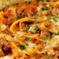 Spicy Baked Chipotle Pasta · Sausage, pepperoni, ground beef, mozzarella cheese, and chipotle cream marinara sauce with r...