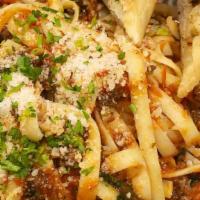 Fettuccini Bolognese · Caramelized onion, ground beef, fresh basil, and marinara sauce with roasted garlic parmesan...