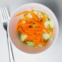 Cucumber Salad · Fresh cucumbers, carrots and red onions with Thai clear sweet dressing.