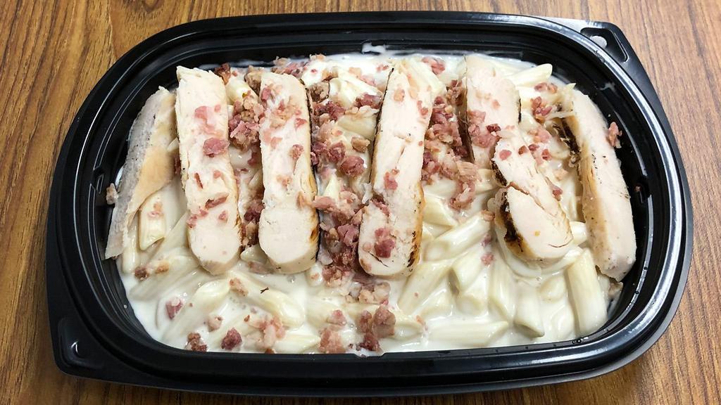 Chicken Mac & Cheese Meal · White cheddar macaroni and cheese topped with all white meat chicken and bacon bits.