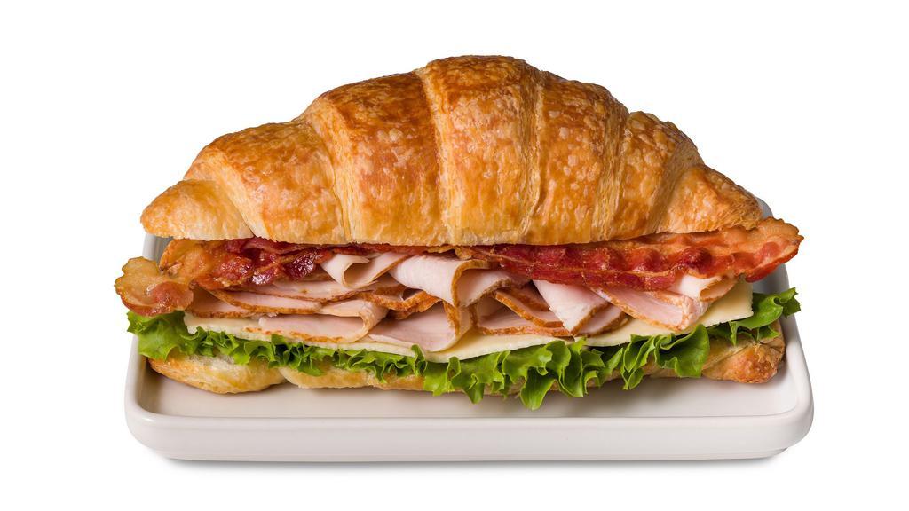 Turkey Bacon Croissant Sandwich  · Sliced turkey breast, bacon, havarti and leaf lettuce on a savory, flaky croissant.