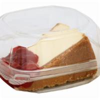 Colossal Cherry Topped Cheesecake Slice · New York style cheesecake on a buttery graham cracker crust, covered with a cherry topping.