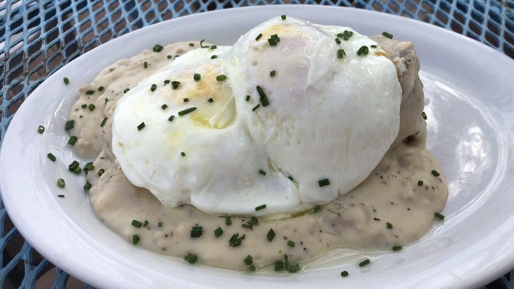 Biscuit & Gravy · Fresh baked biscuit smothered in our signature country sausage gravy. Add an egg at an additional cost.