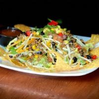 Taco Salad · Your choice of chicken or ground beef atop lettuce, fire roasted corn salsa, pepper jack and...
