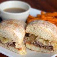 Prime Rib Dip Sandwich · Sliced prime rib with caramelized onions and swiss cheese on a toasted ciabatta bun. Served ...