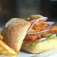 Cajun Chicken Sandwich · Fried cajun chicken breast with roma crunch lettuce, shaved red onion and sliced tomatoes to...
