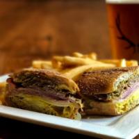 Cuban  · Sliced ham, slow roasted pork shoulder, spicy mustard, dill pickles and swiss cheese.