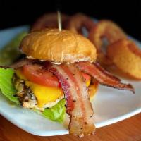 The Chicken Club · Grilled chicken breast, peppered bacon, cheddar cheese, lettuce, tomato, guacamole and chipo...