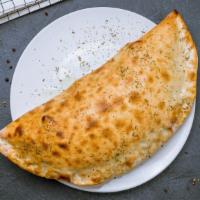 Super Supreme Calzone · Delicious calzone made with Pepperoni, Sausage, black olives, green pepper, mushrooms, and o...