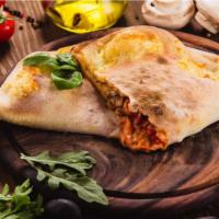 5-Meat Calzone · Delicious calzone made with Pepperoni, Italian sausage, ham, bacon, and beef. Served with Ma...