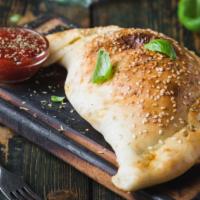 Meatball Calzone · Delicious calzone made with Meatballs, Mozzarella and Ricotta cheese. Served with Marinara s...