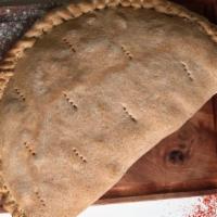 Veggie Calzone · Delicious calzone made with Mushrooms, onions, green peppers, black olives and diced tomatoe...