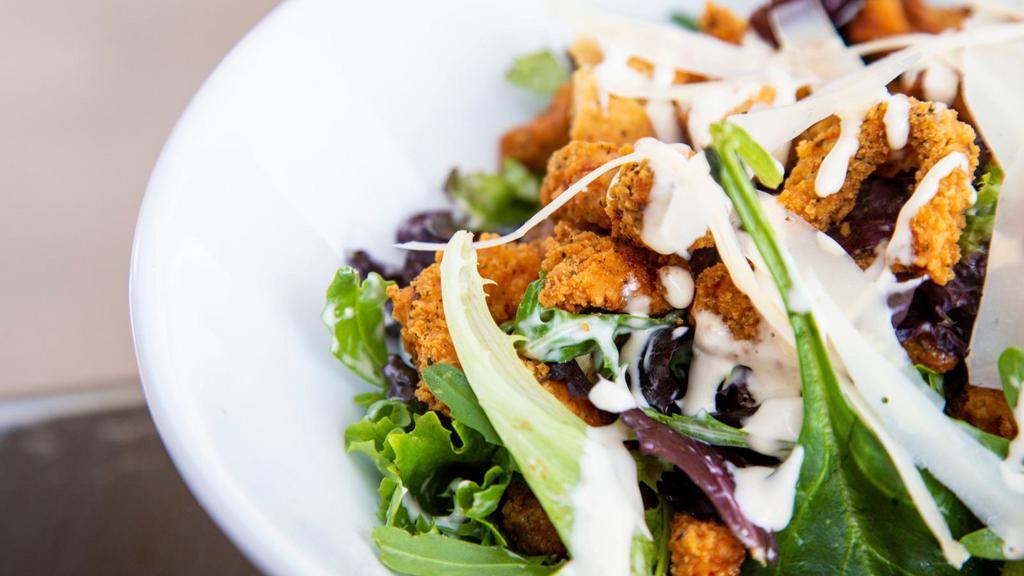 Fresh Crispy Chicken Salad · Fresh Salad prepared with lettuce, tomatoes, black olives, mozzarella cheese, cheddar cheese and crispy chicken.