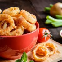 Jumbo Crispy Onion Rings · Classic crispy large white onions sliced into rings, dipped in a batter and bread crumbs the...