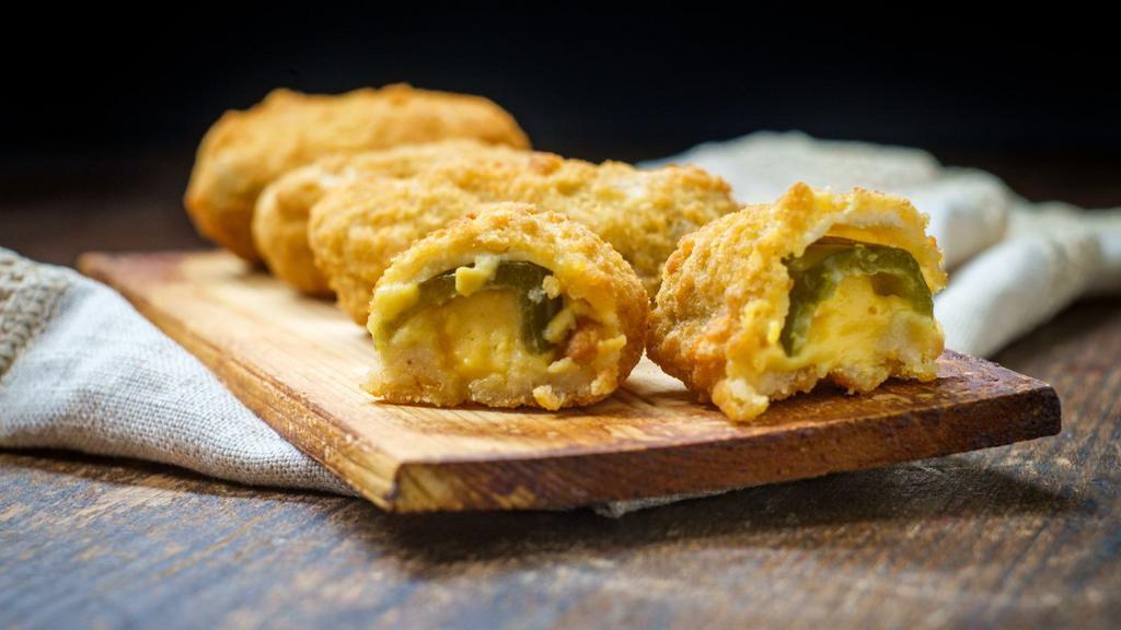 Jalapeño Peppers · Delicious poppers filled with cream cheese and jalapeños, battered and fried to perfection.