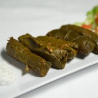 Dolmades · Ground beef, rice rolled in grape leaves topped with a lemon cream sauce.