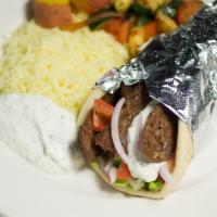 Gyros Plate · Thinly sliced layers of seasoned lamb and beef broiled on a vertical skewer with onions, tom...