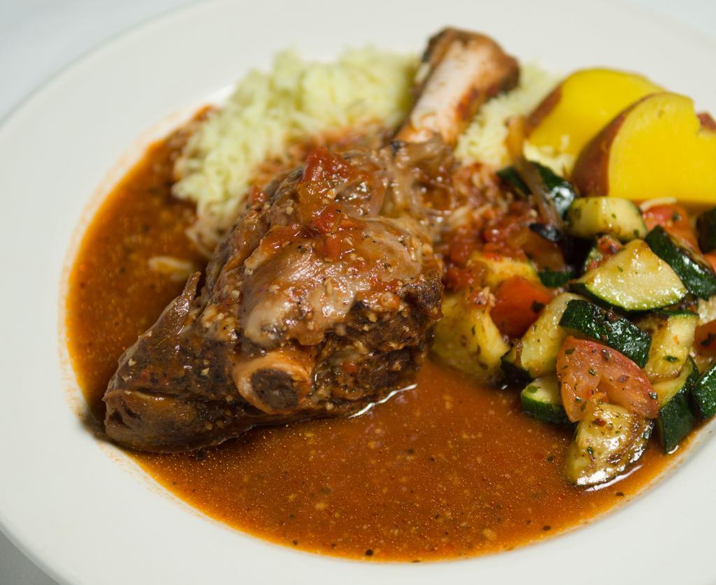 Lamb Shank · Slow roasted and tender until it falls off the bone.