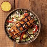 Greek Salmon Chickpea Bowl · The sun shines on this bowl, including brown rice quinoa blend, salmon, marinated artichokes...