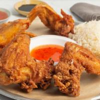 Crispy Thai Chicken Wings · Irresistible thai style crispy chicken seasoned with fresh thai herbs and sprinkled with gol...