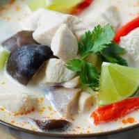 Tom Kha · Hot and sour soup with coconut milk, mushrooms and chili paste.