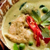 Green Curry · Green curry paste, coconut milk, bell peppers, bamboo shoots, green beans, and basil.