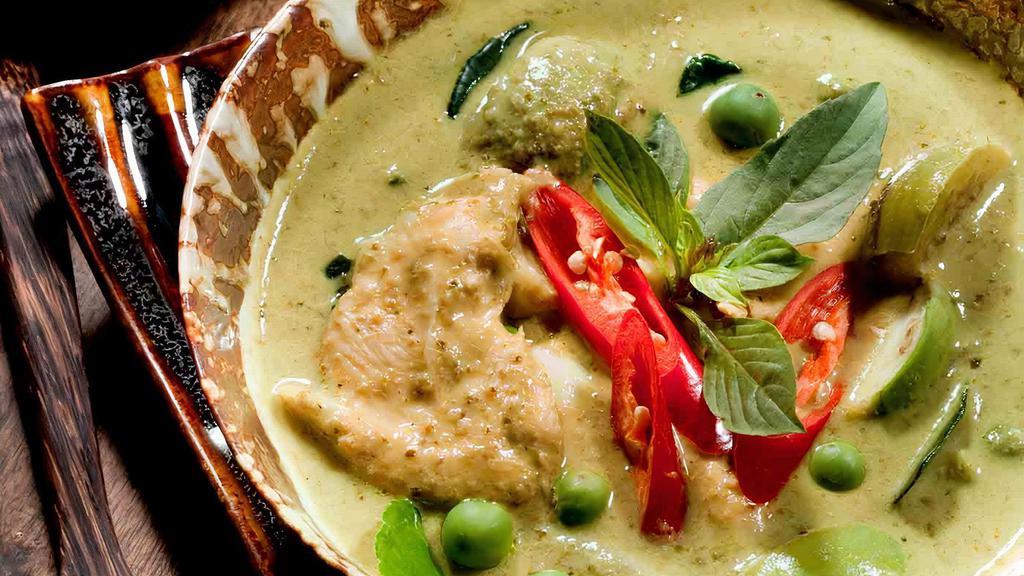 Green Curry · Green curry paste, coconut milk, bell peppers, bamboo shoots, green beans, and basil.